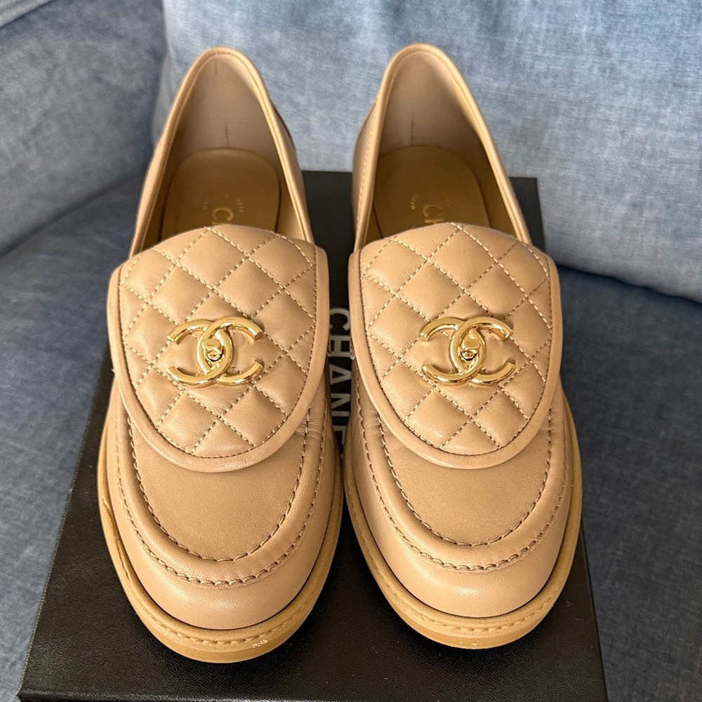CHANEL Beige Quilted Loafers with gold accents